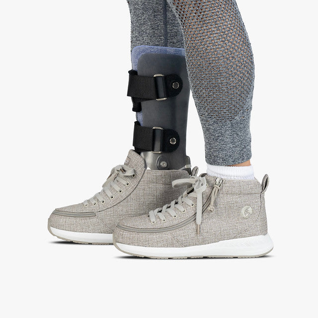 Kids wearing a Goat High Top Sport Grey Jersey shoe, featuring wrap-around zipper and leg brace, showcasing Billy Footwear's AFO-friendly design.