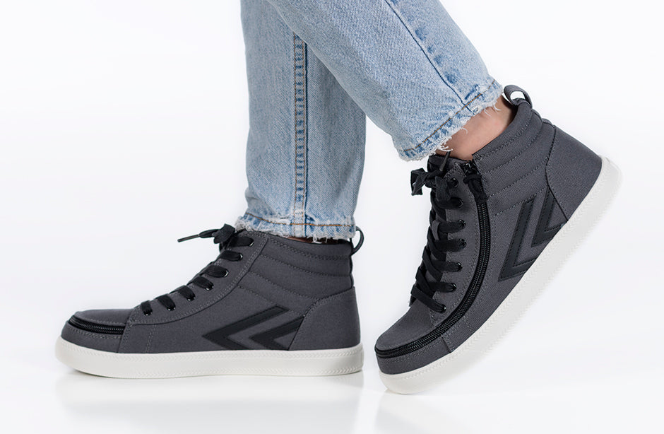 Charcoal/Black BILLY CS Sneaker High Tops worn with jeans, featuring functional laces, removable insoles, and a wraparound zipper for accessibility.