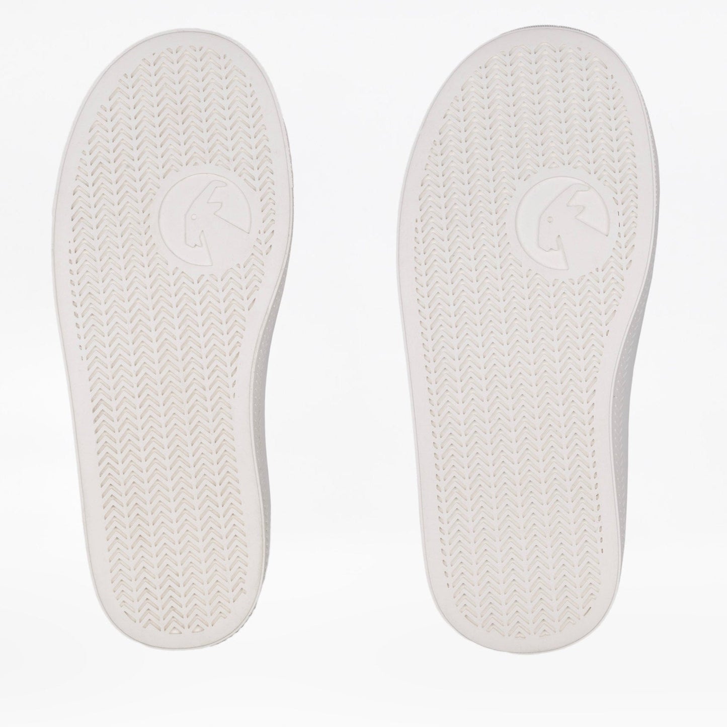 Two white shoe insoles shown side by side on a light background showing width differences. Both insoles have a textured tread pattern and a circular goat-head logo near the center.